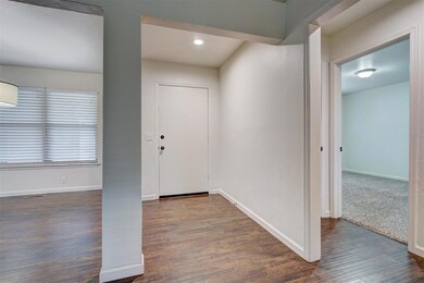 Entryway featuring dark wood-type flooring