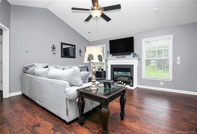 Laminate wood floors , ceiling fan , marble firepl