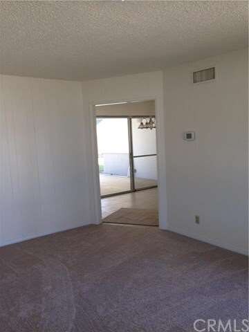 IN LIVING ROOM LOOKING INTO KITCHEN AREA...NEW CAR