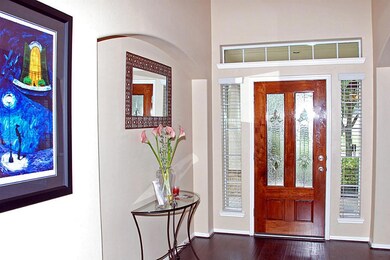 Two story entryway with art niches.