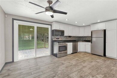 Updated Eat-in Kitchen with sliding glass door tha