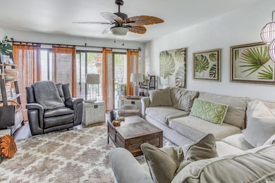 Living room featuring ceiling fan