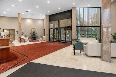 Elegant lobby entry featuring 24-hour security and full-time doorman service.