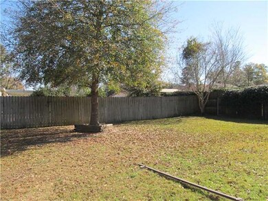 Backyard. Backyard has a lovely live oak and priva