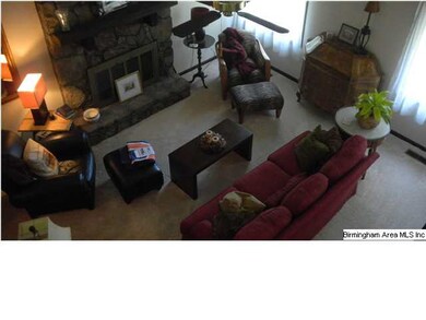 Two story living room with vaulted ceilings