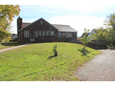 Exterior Back. Blacktop driveway