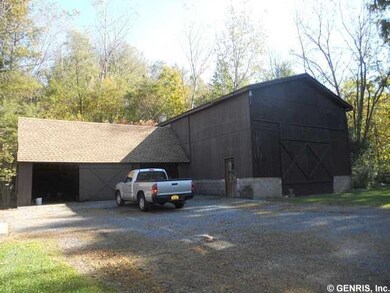 Barn. Barn with attached 3-car garage.