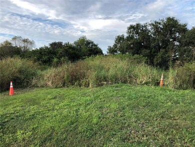 Entrance to the lot is between the cones.