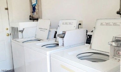 Shared laundry featuring washing machine and dryer