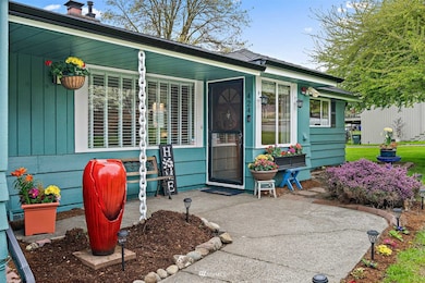 Gorgeous mature landscaping with fruit-bearing trees and welcoming walk-ways