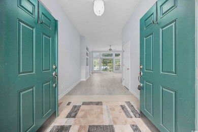 Entryway featuring a ceiling fan, baseboards, and 