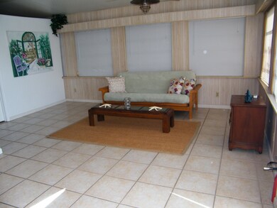 LARGE LIVING ROOM W/ALL TILE FLOORS