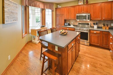 Well appointed kitchen features corian center isla
