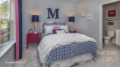 REPRESENTATIVE PHOTOS-Upstairs bedroom with en suite bath.