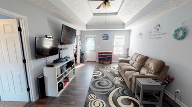 Living room with a door to the back deck