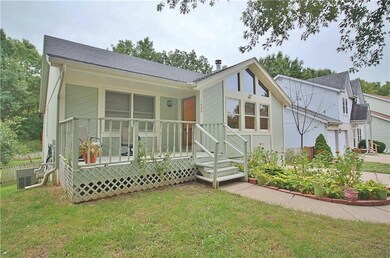 View of the cozy front porch/deck and entry to hom