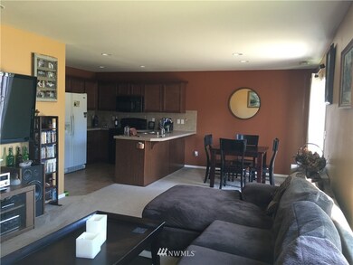 Living room looking into kitchen and Dining room