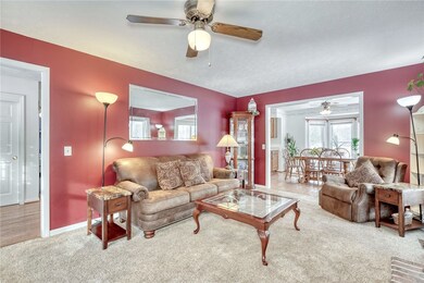 Family room with woodburning fireplace.