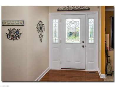 Foyer - hardwood floor leads to formal dining room