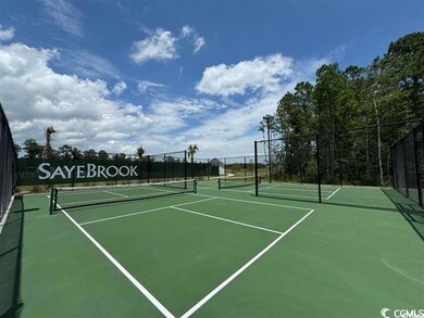 View of tennis court featuring community basketball court