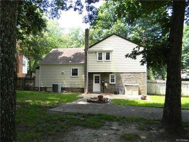 patio space and concrete driveway.