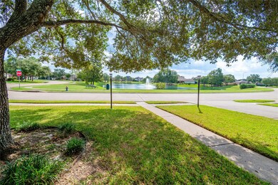 Stunning front door view of a serene lake and lush greenery.