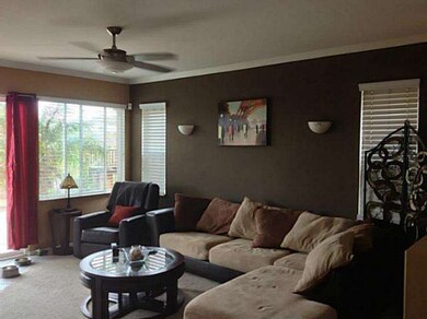 Living room with crown molding and custom paint
