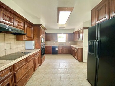 Tons of cabinets and counter space!  Fridge is included.