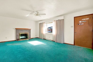 Living room with wood burning fireplace