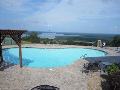 Pool and deck overlooking lake