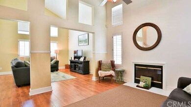 Cozy fireplace, plantation shutters & high ceiling