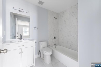 Full Bath Near Kitchen and Bedrooms