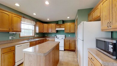 Kitchen custom features include island - accessibl