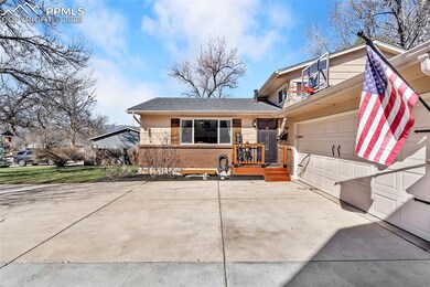 View of front of home featuring driveway and brick