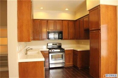 Kitchen with Refinished Cabinets, New Wood Floorin