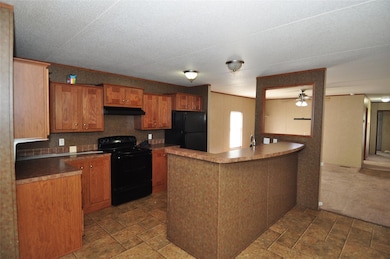 Kitchen with black appliances, under cabinet rang