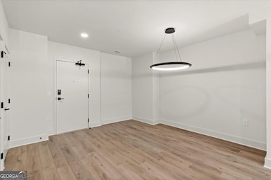 Hardwoods flow throughout the home, modern lighting, large industrial windows allowing in maximum amounts of light