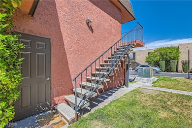 Garage side entrance. Front door at top of stairs.