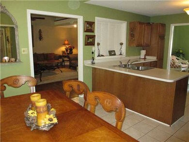 Eat-in Kitchen with tile floor and shuttered hatch