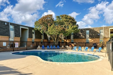 Community pool with a patio area