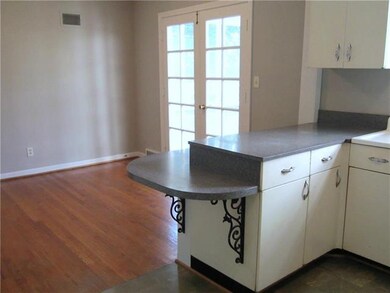 Large Dining Area adjacent to kitchen.  French doo