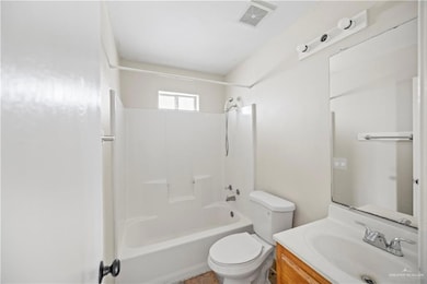 Bathroom with vanity and bathtub / shower combination