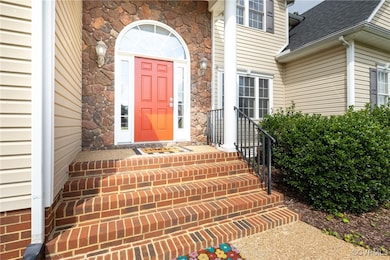 Doorway to property featuring roof with shingles a