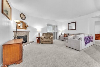 Spacious living room with cozy granite Fireplace a