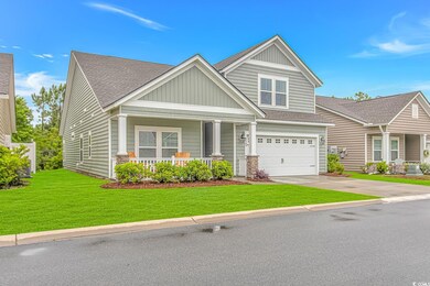 Craftsman house with a shingled roof, an attached 