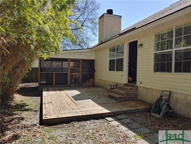 Privacy fenced backyard - open deck and screened porch with hot tub.