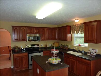 Kitchen. Upgraded Maple cabinets, solid surface co