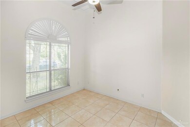 Office/Bedroom featuring ceiling fan and light tile patterned floors