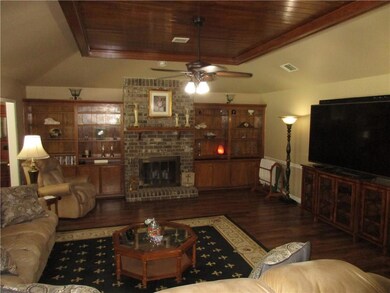 Den with fireplace, built-in bookcases and unique 