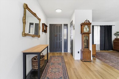 Foyer featuring light wood-style floors